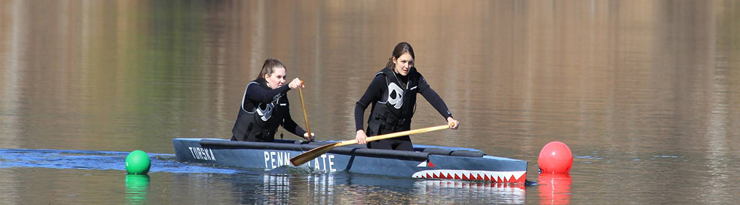 Two students in concrete canoe.