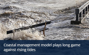 tides extend onto concrete with water splashing over bench