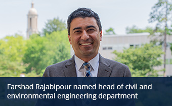 farshad rajabipour standing outside and smiling at camera