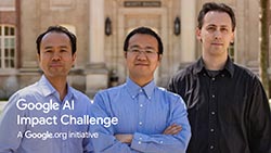 Photo of the three researchers standing in front of building