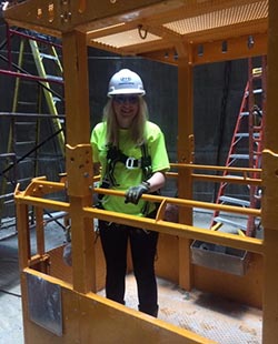standing in a hard hat